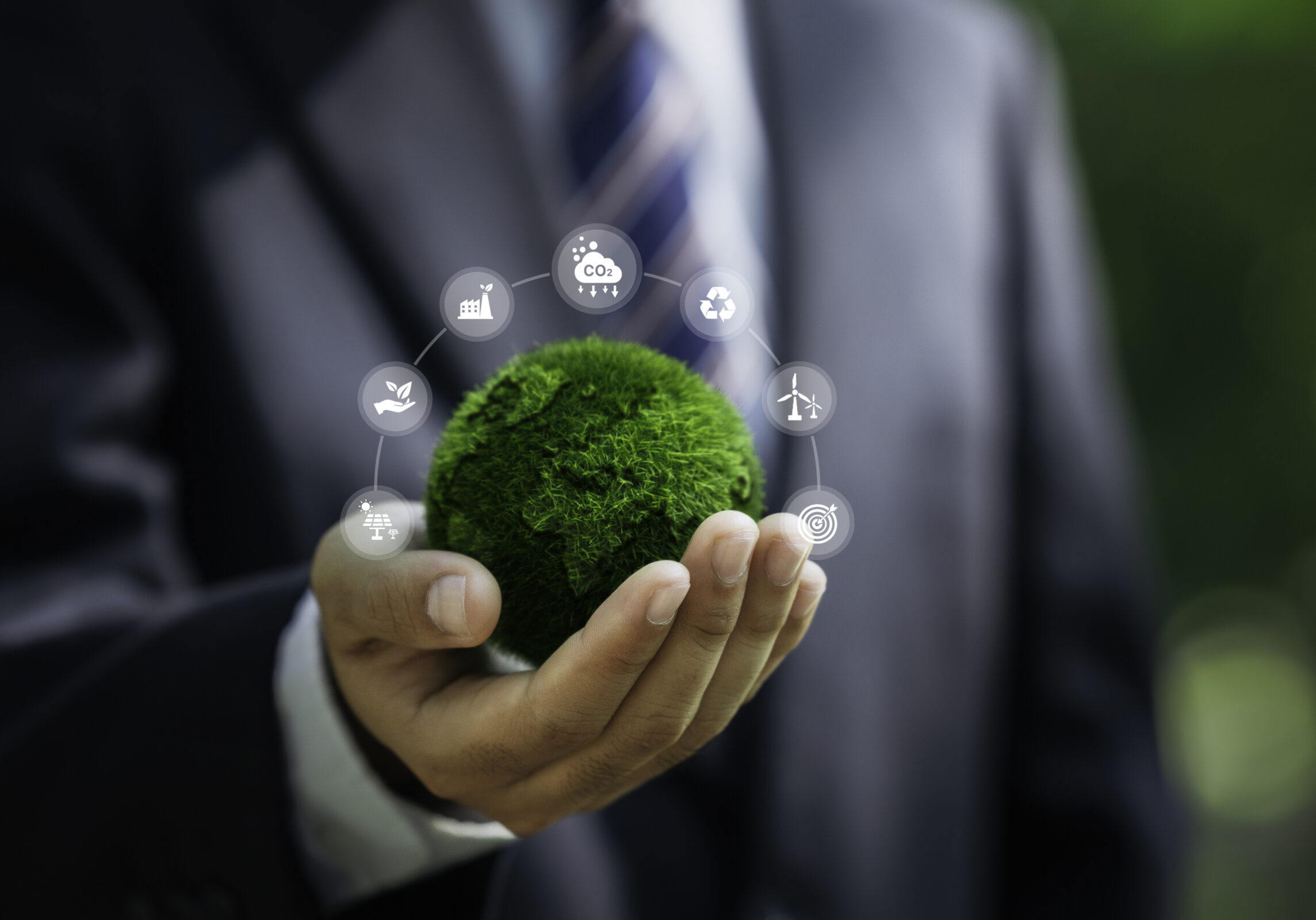 Net zero and carbon neutral concept. Businessman holding world green with Sustainable Environment icon to Net zero greenhouse gas emissions target Climate-neutral long-term strategy. Carbon Neutrality